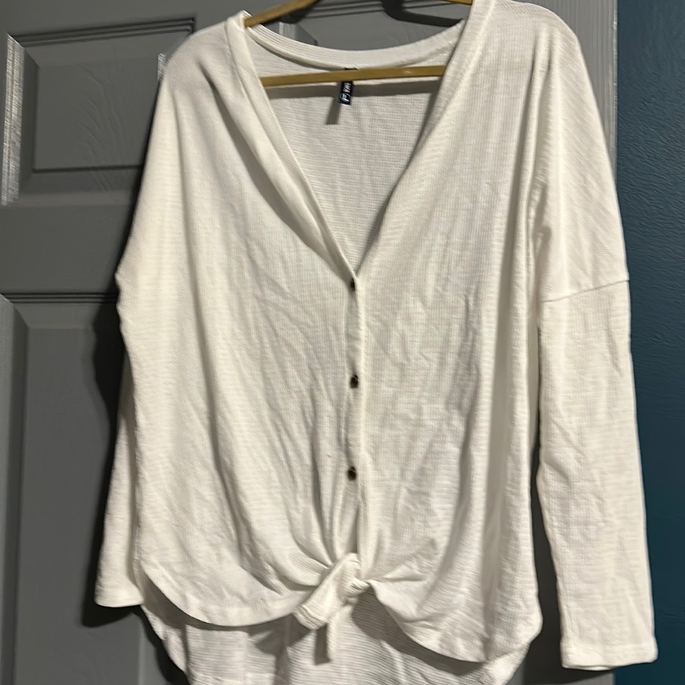 White bathing suit cover up.